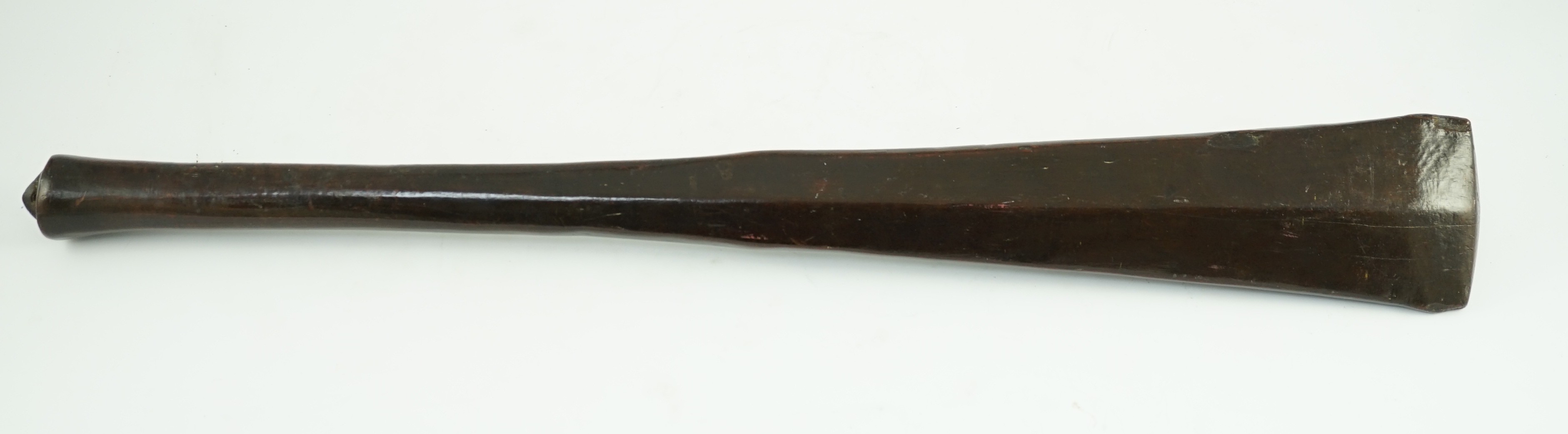 A Bowai Fijian hardwood war club, of tapered triangular section with rounded handle, 65cms long
